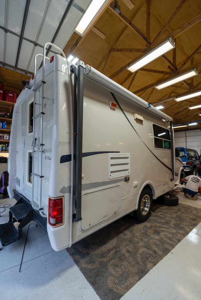 White RV Class B motorhome with restored glossy fiberglass exterior after Re-Gel gelcoat restoration treatment