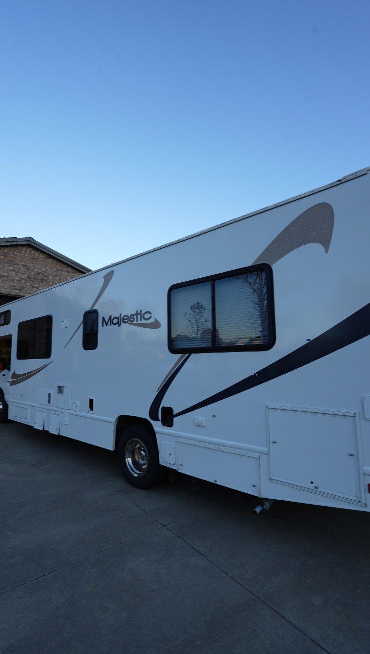 Majestic RV motorhome with restored glossy white fiberglass exterior after Re-Gel gelcoat restoration treatment