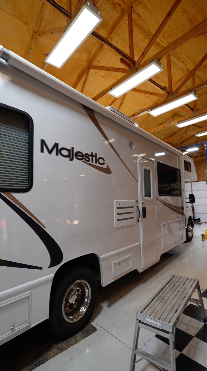 Majestic RV motorhome with restored glossy white fiberglass exterior after Re-Gel gelcoat restoration treatment