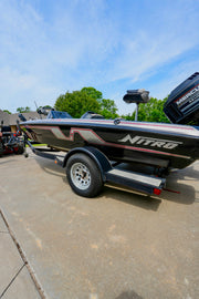 Black Nitro bass boat on trailer with deep glossy finish restored by Re-Gel gelcoat restoration system