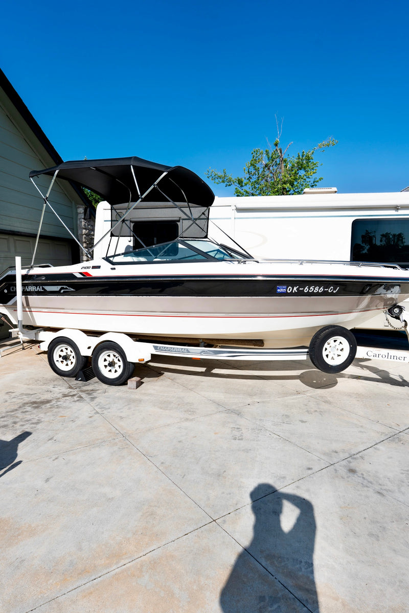 Chaparral boat with restored glossy black and white hull after Re-Gel gelcoat restoration treatment